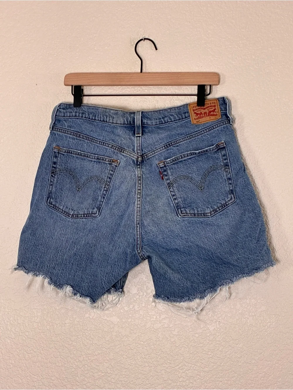Levi’s | 501 button fly raw hem cut off long jean shorts bermuda denim size 32